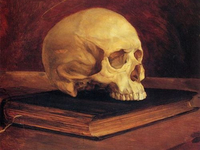 Человеческий череп на старой книге