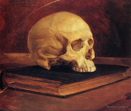 Человеческий череп на старой книге